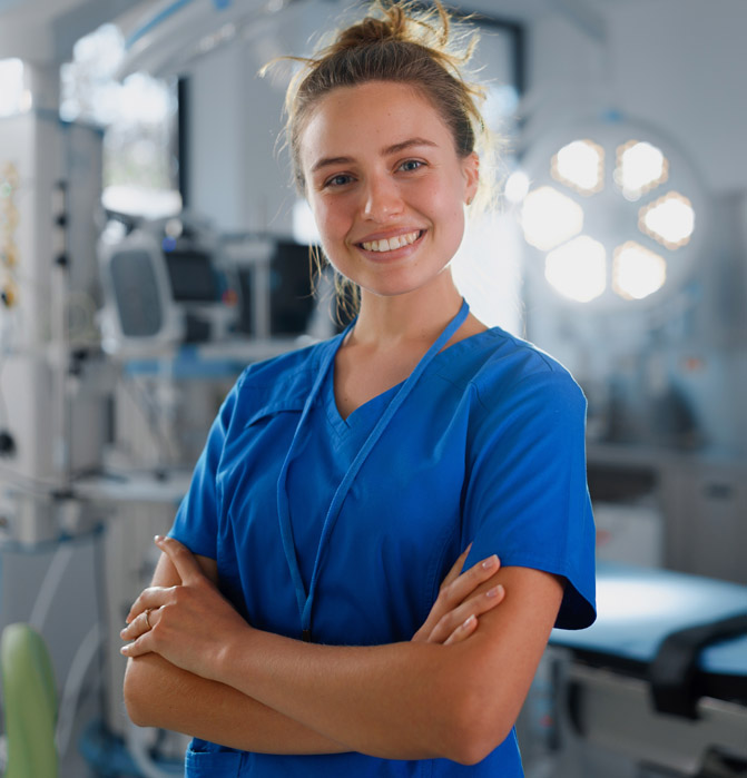 Female doctor sitting and looking at camera
